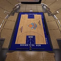 Spacious Basketball Arena Interior With Wooden Court Blue Design And Seating Sections