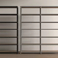 Two Black and Gray Multi Tiered Shelf Units on Wooden Floor with White Wall