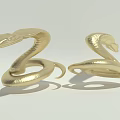Two Golden Snakes With Coiled Bodies And Shiny Metallic Surface