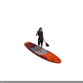 Woman in black wetsuit standing on orange and blue paddleboard holding red and black paddle
