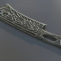 Ornate Decorative Metal Weapon with Intricate Carved Patterns on Blade and Handle