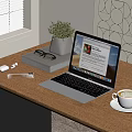 Open Silver Laptop on Wooden Desk with Coffee Mouse Notebook and Green Plant