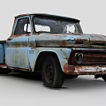 Old Blue Rusty Pickup Truck With Damaged Windows And Rusted Body Panels