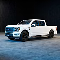 White Modern Pickup Truck With Crew Cab And Black Wheels In Indoor Setting