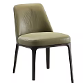 Various Colored Modern Chairs With Leather And Fabric Upholstery And Black Legs