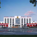 Fire Rescue Office Building With Red White Exterior Glass Curtain Walls Front Plaza and Trees
