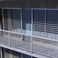 White Metal Grid Design Balcony Railings On Multi story Building With Gray Wall