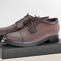 Brown Leather Formal Shoes Showcased on Black and Beige Storage Box