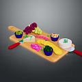 Assorted Cheese Platter with Grapes Blue Bowls on Wooden Cutting Board and Red Handle Knives
