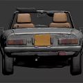 Silver Vintage Convertible Car With Tan Leather Seats And Sleek Body Design