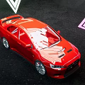 Red Sports Car Displayed With White Neon Triangle Light In Dark Background