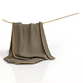 Brown Towel With Yellow Trim Folded Hanging On A Rope In Laundry