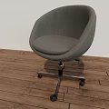 Gray Modern Office Chair With Fabric Seat And Metal Base On Wheels