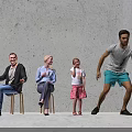 Group of People Sitting Standing Against Gray Wall on Light Floor With Child Pom Poms