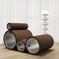 Brown Cylindrical Design Single Sofa With Metal Accents And White Spiral Lamp On Wooden Floor