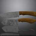 Kitchen Knives With Wooden Handles And Worn Metal Blades On Dark Surface With Reflections