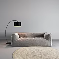 Modern Minimalist Gray Large Sofa With Black Floor Lamp And Light Colored Rug