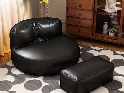 Black Leather Round Single Sofa With Matching Ottoman On Patterned Rug In Living Room 3d model