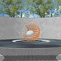 Red Spherical Sculpture With Silver Center In Circular Pool Surrounded By Trees And Gray Wall