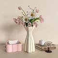 White Striped Vase With Pink And White Flowers On Light Table With Books And Decor