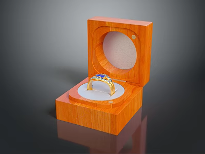 Gold Ring With Blue Gemstones In Open Wooden Box With White Padding 3d model
