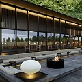 Tranquil Courtyard Garden With Lush Trees Open Seating And Warm Lighting