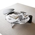 Modern Round Coffee Table With Marble Top Open Book Glass Cup And Magazines