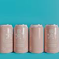 Refreshing four pink lychee beer drink cans with stylish packaging on blue background