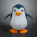 Geometric Penguin Toy With Dark Blue Head White Body Orange Beak Feet And Gray Background