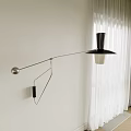 Modern Wall Lamp with Black Lampshade and Silver Curved Bracket on White Wall Near Curtains