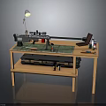 Weapon Assembly Process On Wooden Workbench With Tools Laptop Lamp And Paints