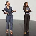 Two Women Wearing Blue And Black Jumpsuits Holding Folders In Presentation Space