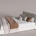 White Upholstered Double Bed with Curved Headboard White Sheet Brown Throw and Gray Pillows