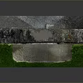 Scenic View of Ancient Stone Arch Ruins With Intricate Carvings And Lush Green Grass