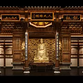Ancient Architecture Interior With Golden Buddha Statue Wooden Structure And Carvings