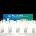 China Eurasia Expo Conference Venue With Podium Backdrop Tables Chairs And Water Bottles