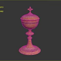 Yellow Carved Sculpture Vessel With Intricate Patterns And Cross Topped Lid On Pedestal Base
