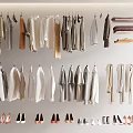 Hanging Clothes In Various Styles With Shoes Displayed In Wardrobe Area