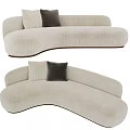 Beige Curved Sectional Sofa With Plush Upholstery Gray Pillows And Modern Design