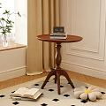 Wooden Round Side Table with Pedestal in Cozy Room with Potted Plant and Open Book