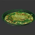 Appetizing Tasty Food in Black Plate with Yellow Main Red Garnish and Fresh Green Leaves