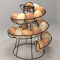 Brown and White Eggs Arranged in Multi Tiered Black Metal Rack