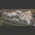 Open Pit Mined Terrain With Layered Slopes Access Roads And Excavated Areas