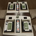 Traditional Japanese Dining Table Setup With Burlap Pillows Green Plates Chopsticks And Decorative Vase