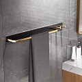 Bathroom Interior with Marble Wall Black Gold Towel Rack Gray Towel and Toiletries