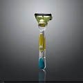 Modern Colorful Razor With Green Head Yellow Accents And Blue Handle Grip