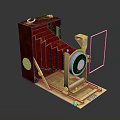 Vintage Red Foldable Camera With Golden Lens And Leather Body Design