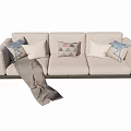 Modern Three Seater Sofa With Beige Upholstery Decorative Pillows And Throw Blanket 3d model