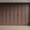 Modern Wooden Wardrobe with Sleek Panel Design and Minimalist Door Handles in Bright Interior Space