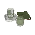 Transparent Glass Cups With Ice Cubes On Marble Tray And Green Leather Notebook